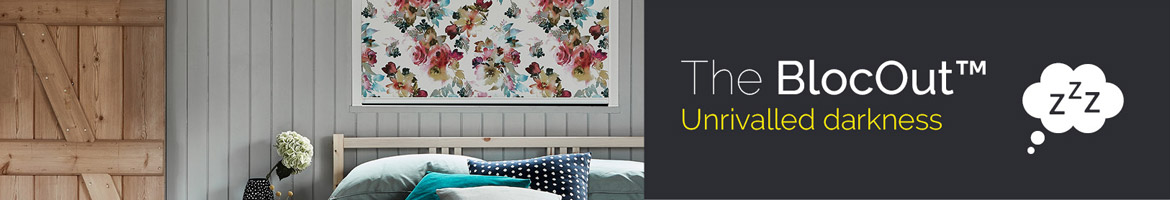 Floral patterned blocout blind in bedroom with motto unrivalled darkness