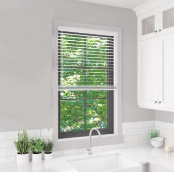 Wooden venetian blind fitted to window above kitchen sink
