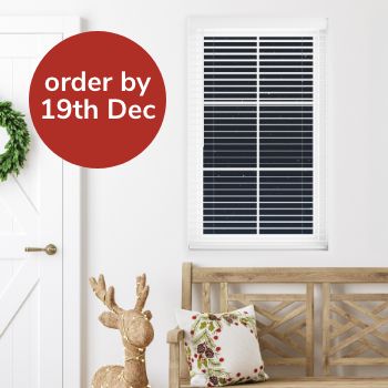 Wooden venetian blind fitted to window